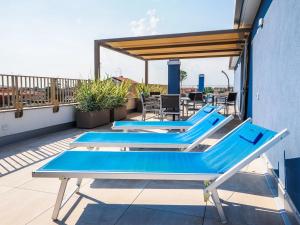 two ping pong tables on the roof of a building at Hotel Angelo in Caorle