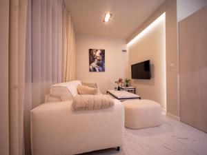 a living room with a chair and a stool at Sweet Dreams Apartment in Zator +3 photos