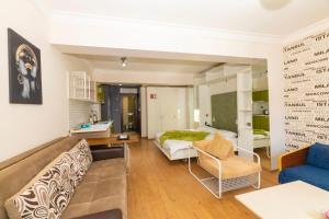 a hotel room with a bed and a couch at Taksim full House in Istanbul