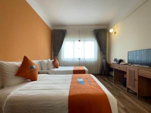 TV a/nebo společenská místnost v ubytování Sapa Legacy Hotel