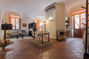 a living room with a couch and a table at La Casa del Polpo Giallo by Wonderful Italy in Turin