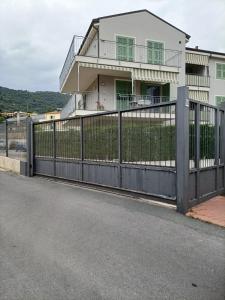a fence in front of a house at Plumosus in Arma di Taggia