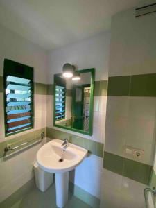 a bathroom with a sink and a mirror at Finca Valdegrullas in Candeleda