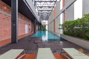 a hallway with a swimming pool in a building at Millerz Square Kuala Lumpur, Travelet in Kuala Lumpur +29 photos