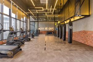 a gym with a row of treadmills and machines at Millerz Square Kuala Lumpur, Travelet in Kuala Lumpur