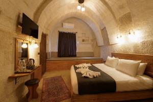 TV a/nebo společenská místnost v ubytování Göreme Escape Cave