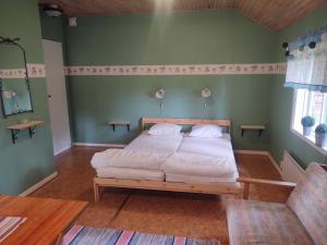 Postel nebo postele na pokoji v ubytování Selholmens Camping