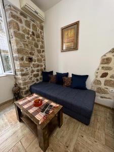 a living room with a couch and a table at Royal House in Kotor