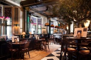 a restaurant with tables and chairs and a bar at The Harrogate Inn - The Inn Collection Group in Harrogate +85 photos