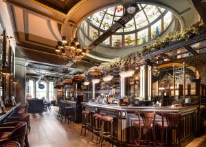 a bar in a restaurant with a domed ceiling at The Harrogate Inn - The Inn Collection Group in Harrogate