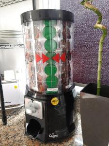 a blender sitting on a counter next to a plant at Hospedaje Athena in Pontevedra