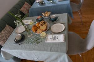 a table with a plate of food on it at Hotel El Rosal de Cudillero in Cudillero