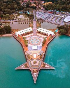 an aerial view of a resort in the water at Khayla Homestay in Kuah