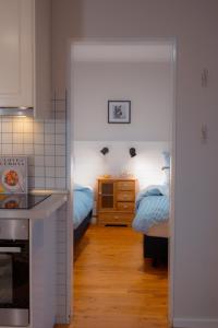 a kitchen with two beds and a kitchen with two beds at Seewind - a15221 in Westermarkelsdorf