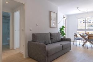 a living room with a couch and a table at Stay In Sunset Campello in El Campello
