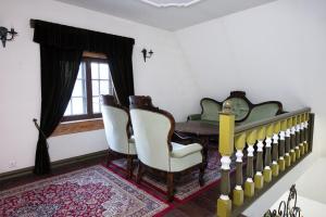 a living room filled with furniture and a window at St. Peterburg in Pärnu
