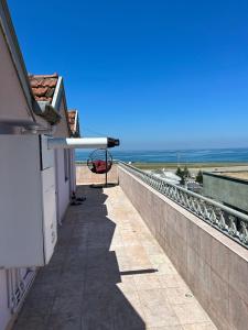 a balcony with a view of the ocean at KARTAL APART in Pelitli