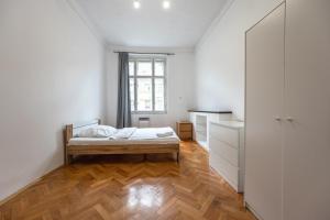 a bedroom with a bed and a window at Jaromirova 9 in Prague