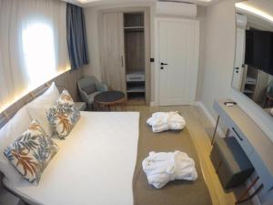 Postel nebo postele na pokoji v ubytování Alessia Hotel