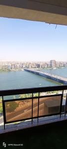 a view of a river from a balcony of a building at Nile Star Suites & Apartments in Cairo