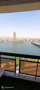 a view of the water from a balcony of a building at Nile Star Suites & Apartments in Cairo