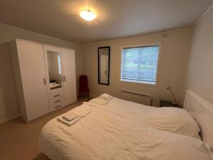 Postel nebo postele na pokoji v ubytování Geiranger booking 17