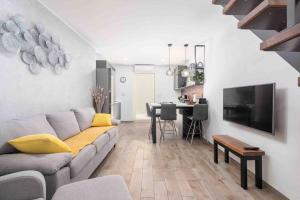 a living room with a couch and a table at Holiday house Mateo in Bubani