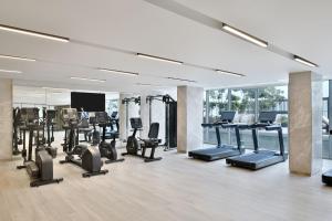 a gym with a lot of treadmills and ellipticals at Le Meridien Amritsar in Amritsar