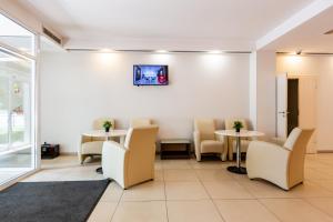 TV a/nebo společenská místnost v ubytování PracticOtel