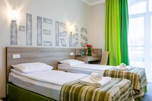Voodi või voodid majutusasutuse PracticOtel toas