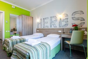 Voodi või voodid majutusasutuse PracticOtel toas