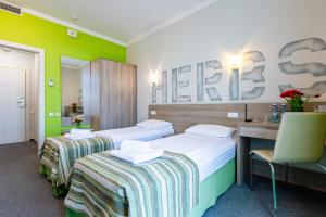Voodi või voodid majutusasutuse PracticOtel toas