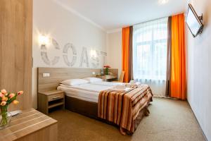 Voodi või voodid majutusasutuse PracticOtel toas
