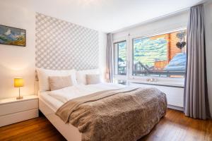Ένα ή περισσότερα κρεβάτια σε δωμάτιο στο Amara Apartment by HomeFlow