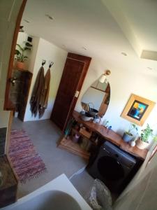 a room with a desk and a mirror on the wall at Appartement 4 personnes in Briançon