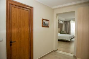 Postel nebo postele na pokoji v ubytování Hotel Dyrrah
