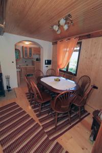 a dining room with a table and chairs at Holiday Home Vesna in Brod na Kupi