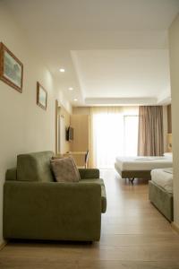 Postel nebo postele na pokoji v ubytování Hotel Dyrrah