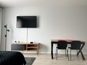 Telewizja i/lub zestaw kina domowego w obiekcie Harmonia Apartments
