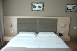 Postel nebo postele na pokoji v ubytování Hotel Dyrrah