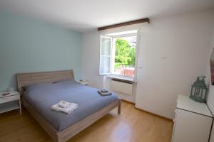 Voodi või voodid majutusasutuse Chalet Cuore delle Alpi toas