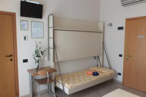 Rúm í herbergi á Hotel Nettuno