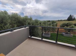 a balcony with a view of the countryside at Villa Onari in Alexandroupoli