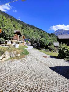 a cobblestone road in front of a house at Bune in Fiesch