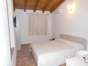 Postel nebo postele na pokoji v ubytování B&B Pettirosso