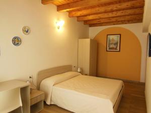 Postel nebo postele na pokoji v ubytování B&B Pettirosso