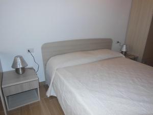 Postel nebo postele na pokoji v ubytování B&B Pettirosso