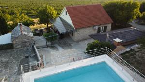 an aerial view of a house with a swimming pool at Vista Kum - Kuća za odmor in Popović