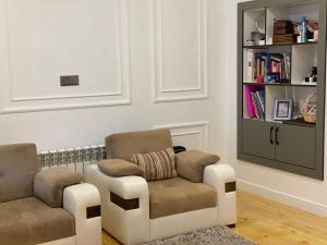 a living room with a couch and a chair at Dream House Oguz in Oğuz