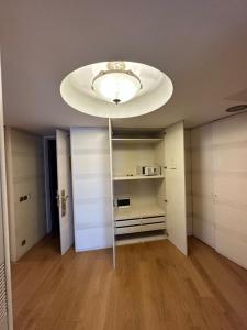 a room with a ceiling with a light fixture at Surmeli Istanbul Hotel in Istanbul